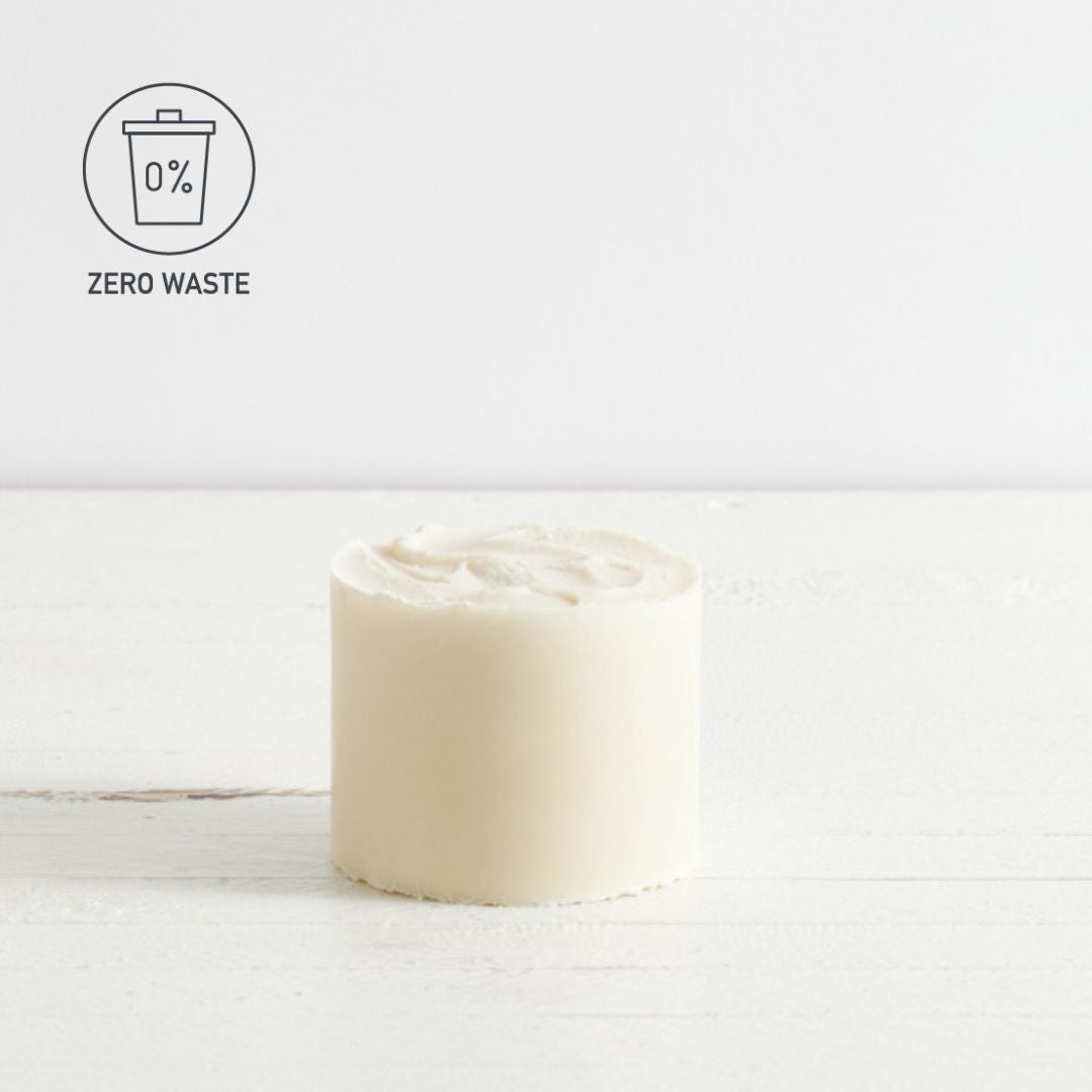 Sebesta Apothecary large round soap block on white background ZERO WASTE logo