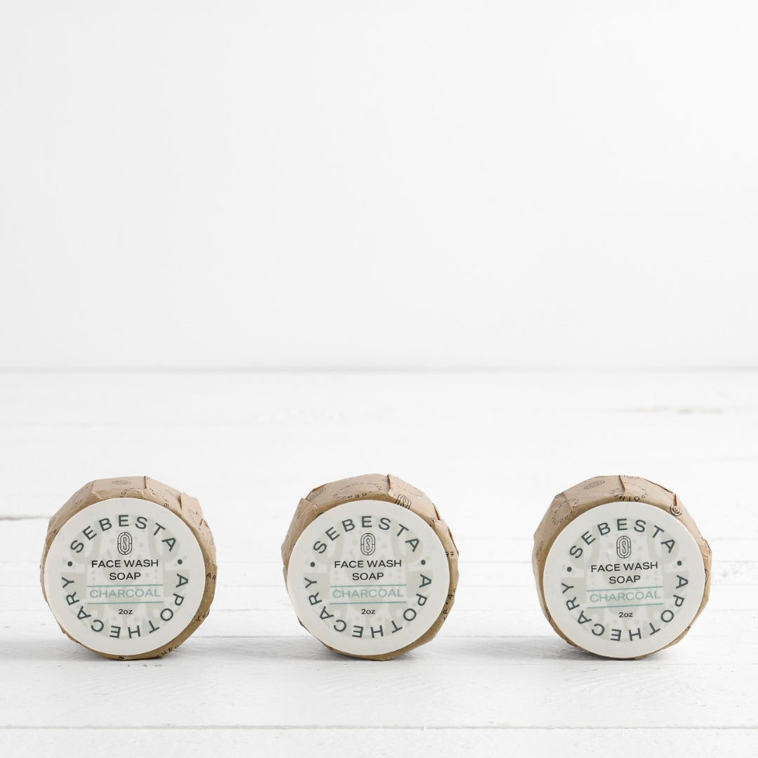 3 round bars of soap with Sebesta Apothecary Branding on white background