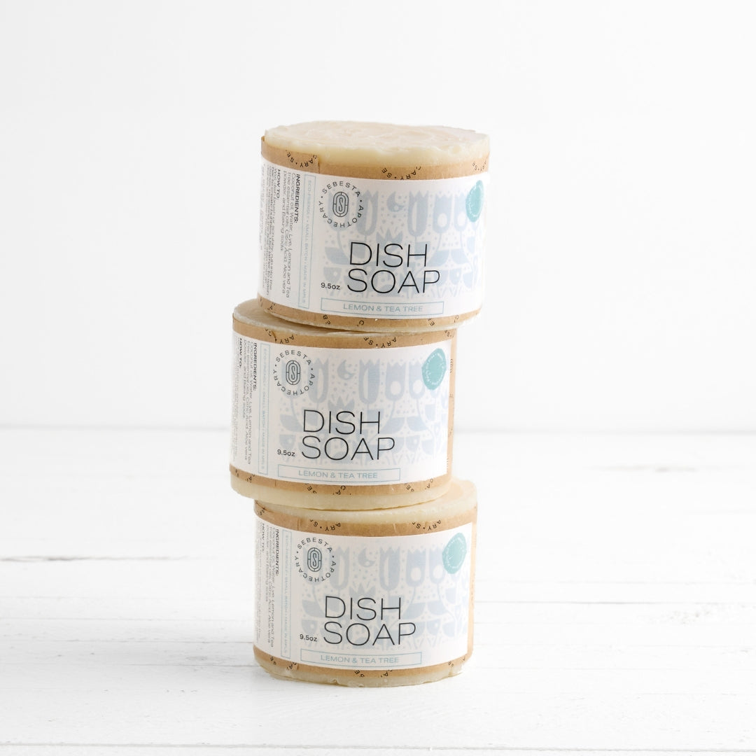 3 large cylinder bars of soap stacked with Sebesta Apothecary Branding on white background