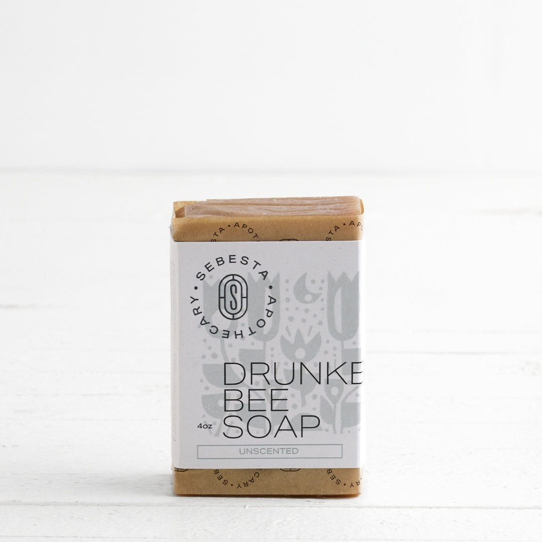 single bar of Drunken Bee Soap with Sebesta Apothecary Branding on a white background