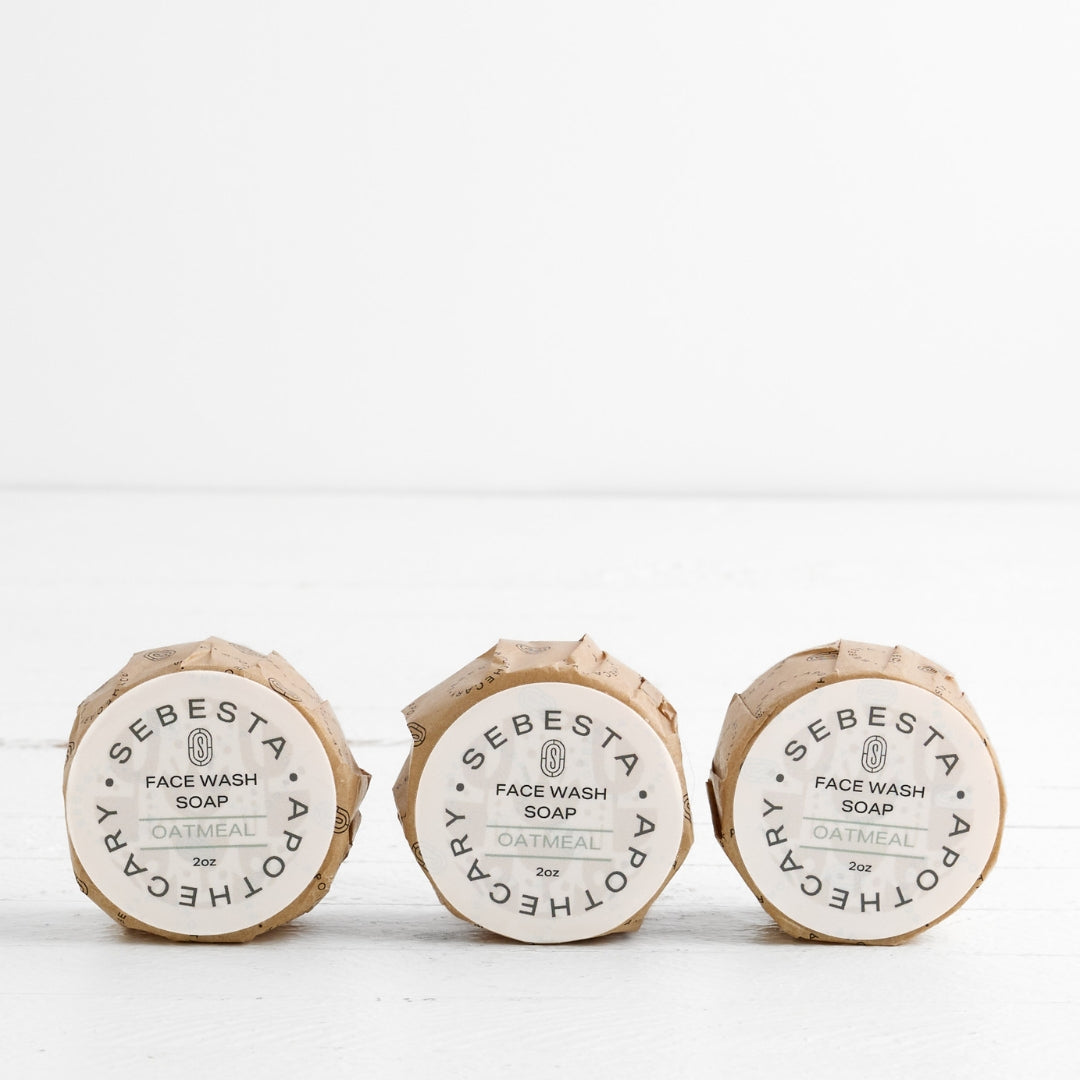 3 round bars of soap with Sebesta Apothecary Branding on white background