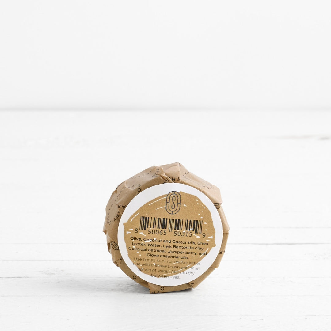 Back label of round Soap in wrapper with Sebesta Apothecary Branding on white background