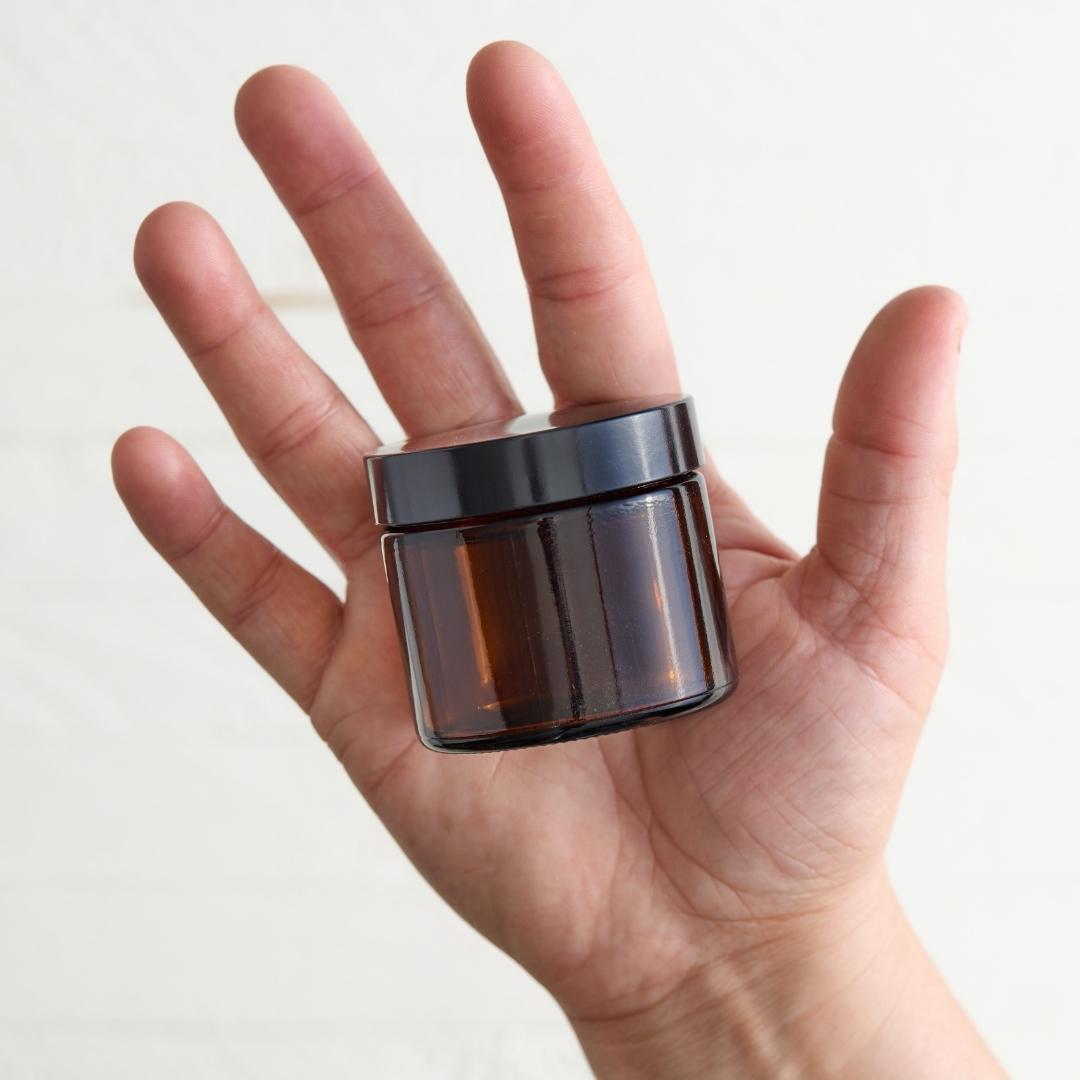 Sebesta Apothecary Clay and Charcoal Face Mask 2oz Jar in Hand