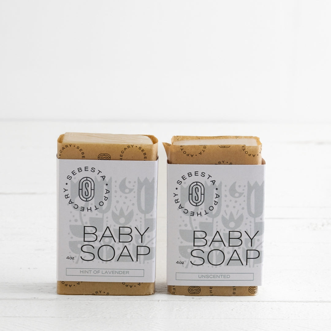 Two bars of Baby Soap Sebesta Apothecary Branding on a white background