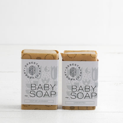 Two bars of Baby Soap Sebesta Apothecary Branding on a white background