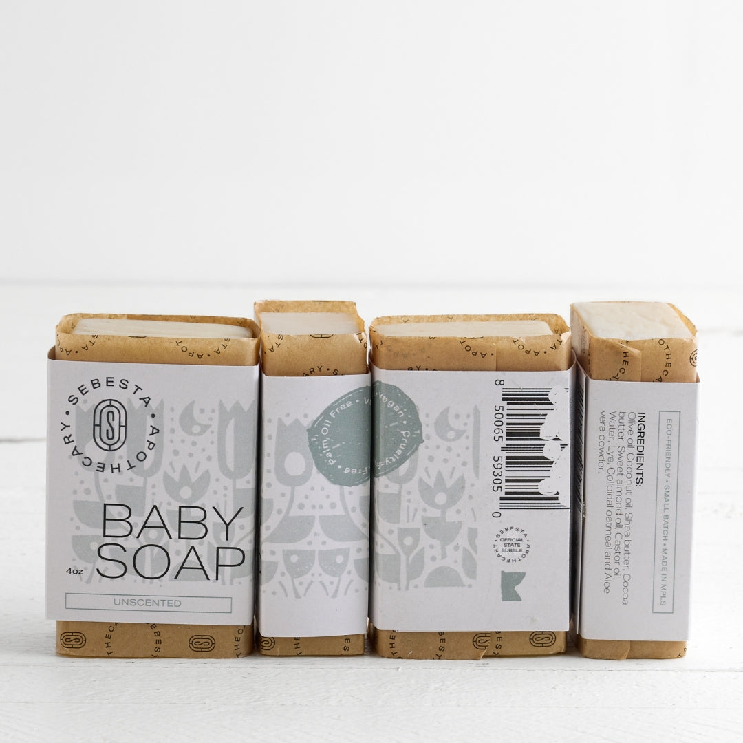 4 bars of Baby Soap Sebesta Apothecary Branding on a white background