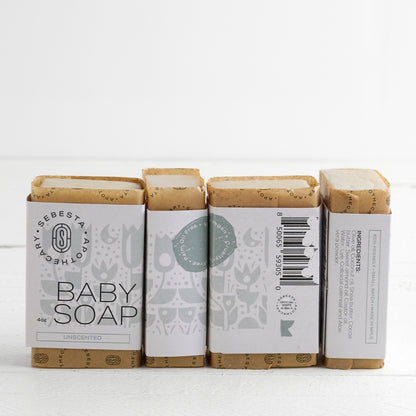 4 bars of Baby Soap Sebesta Apothecary Branding on a white background