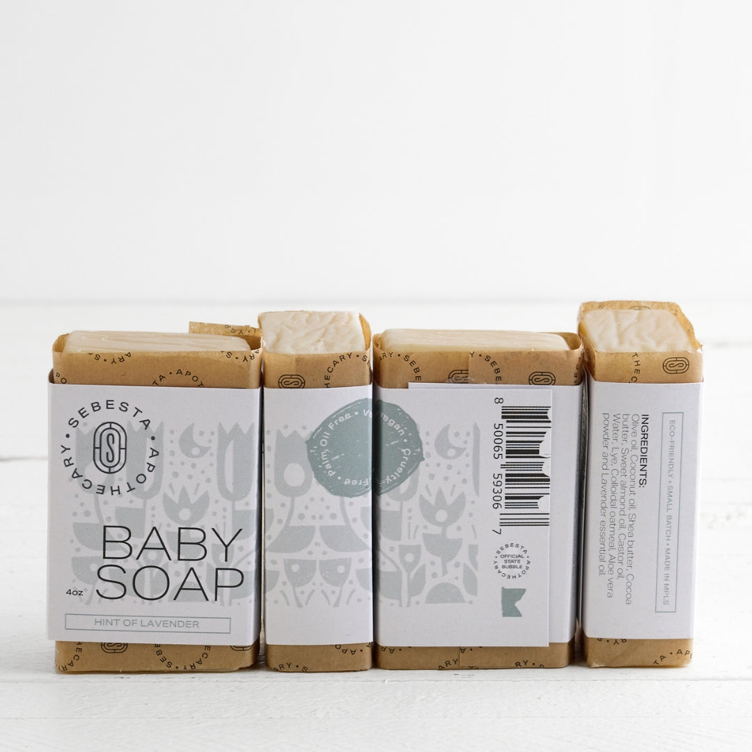 4 bars of Baby Soap Sebesta Apothecary Branding on a white background