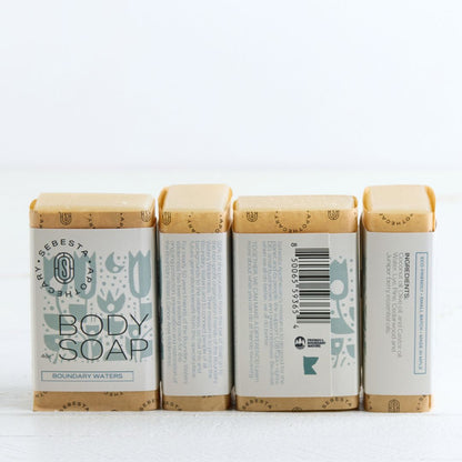 Sebesta Apothecary Soap bars - 4 lined up to show full label all sides. White background and table