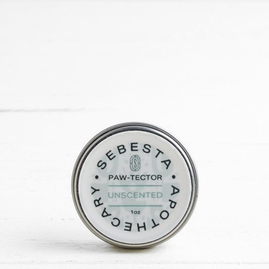 Sebesta Apothecary Paw-Tector tin on a white background