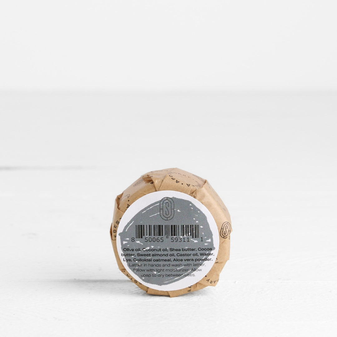 back label of round Soap in wrapper with Sebesta Apothecary Branding on white background
