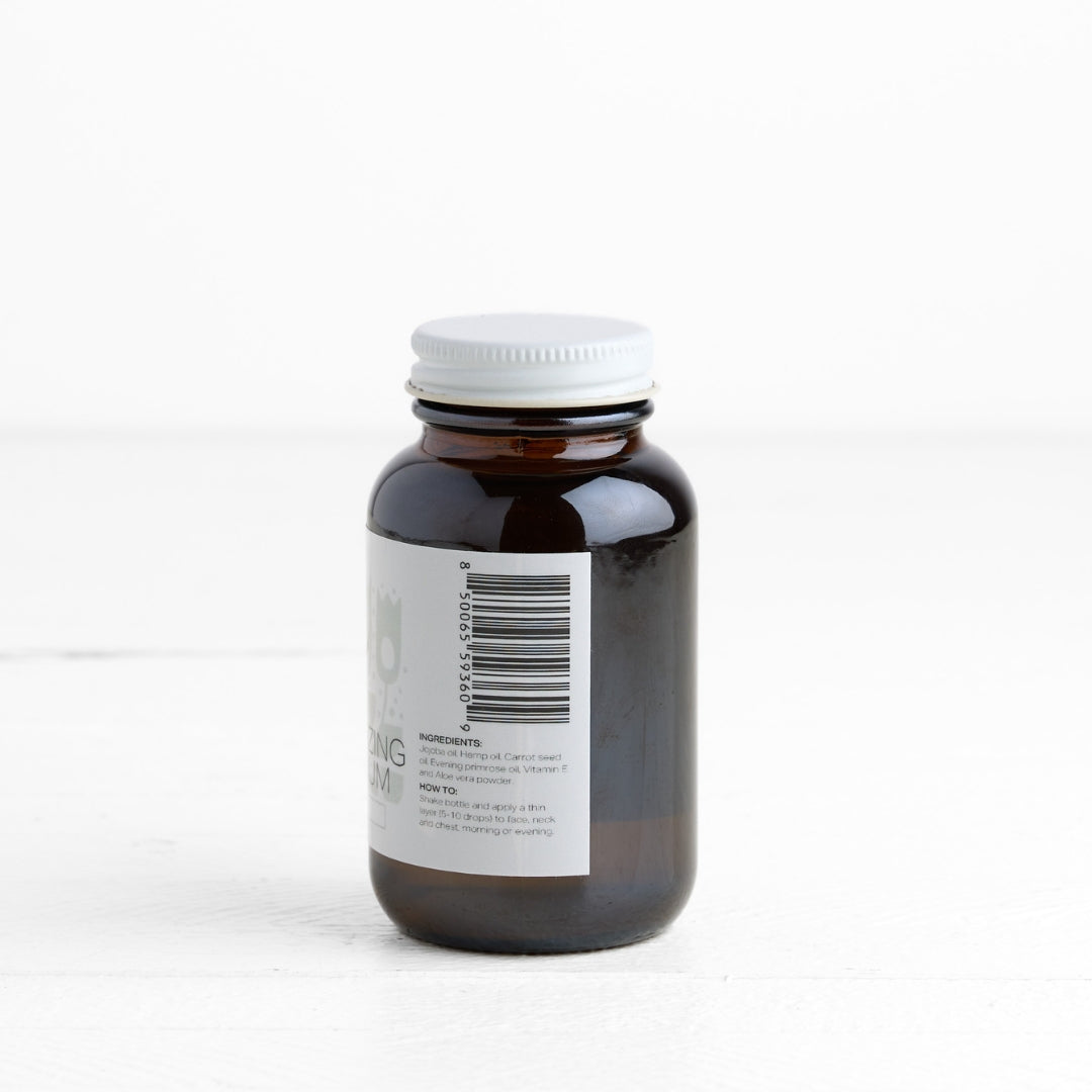 Brown glass bottle with white label on a white background