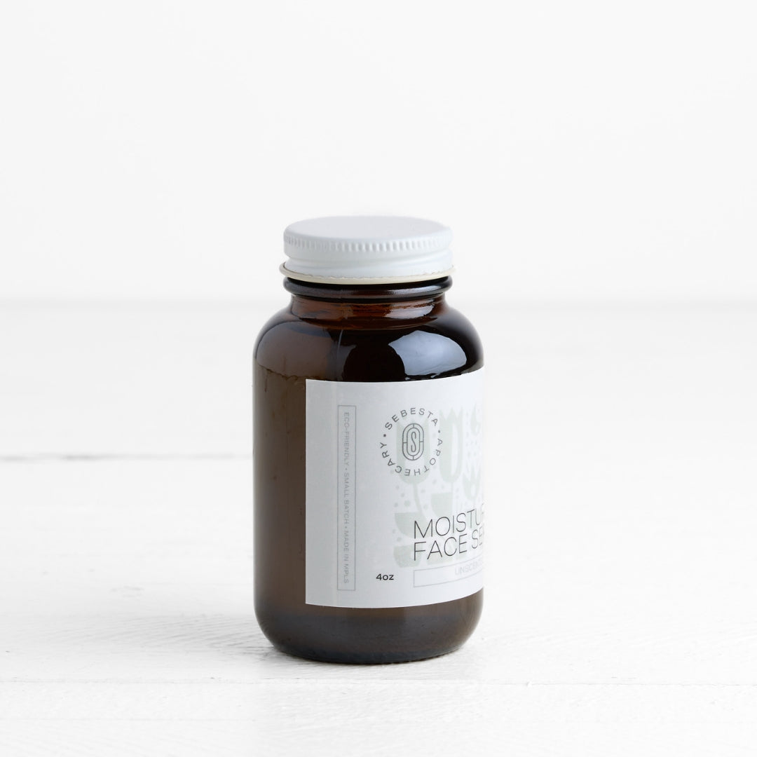 Brown glass jar with white label on a white background