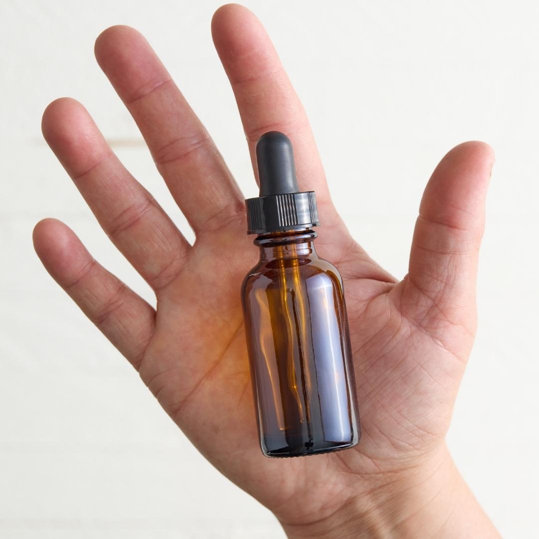 Sebesta Apothecary Cleansing Face Oil Bottle in Hand