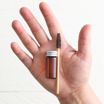 Sebesta Apothecary Lash Serum Vial and Spoolie in Hand